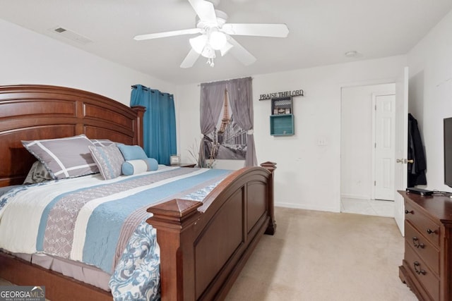 bedroom with ceiling fan and light colored carpet