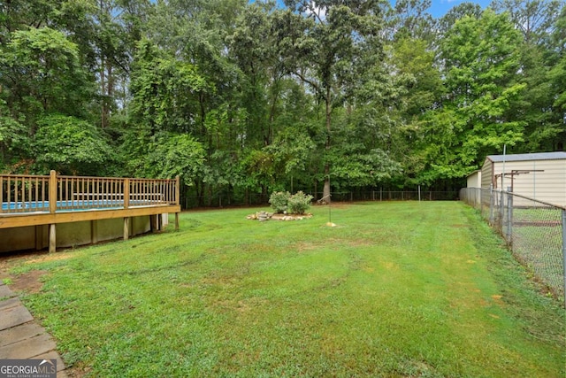 view of yard featuring a wooden deck