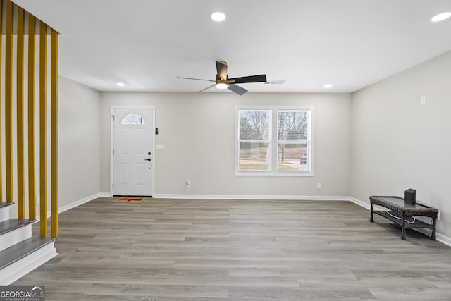 foyer featuring recessed lighting, wood finished floors, and baseboards