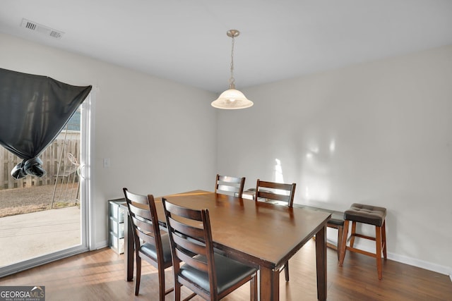 dining room with hardwood / wood-style flooring