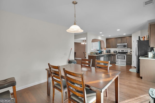 dining area with light hardwood / wood-style flooring