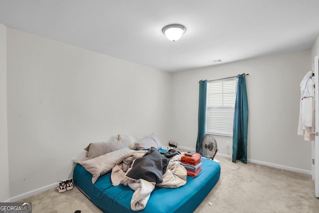 bedroom with light carpet