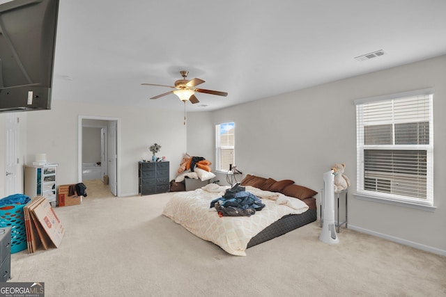 bedroom with ceiling fan and carpet