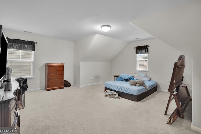 carpeted bedroom featuring vaulted ceiling