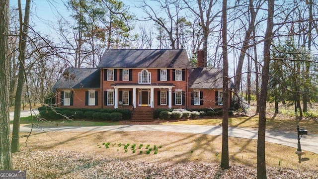 colonial-style house featuring a porch