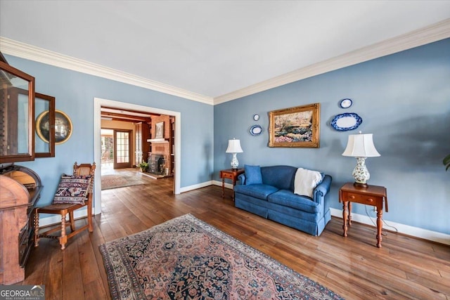 living room with hardwood / wood-style flooring and ornamental molding