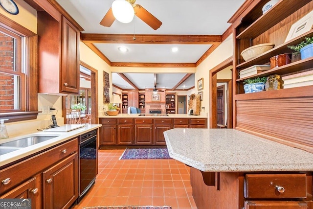 kitchen featuring beamed ceiling, sink, gas cooktop, and a kitchen bar