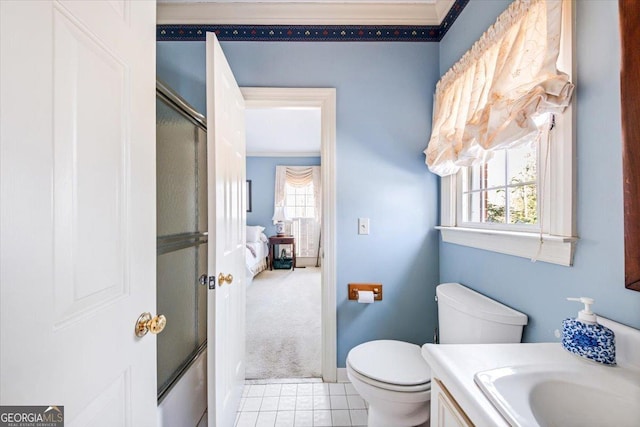 bathroom with vanity, tile patterned flooring, a wealth of natural light, and toilet