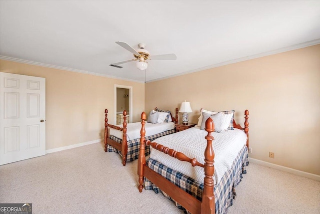 carpeted bedroom with ceiling fan and ornamental molding