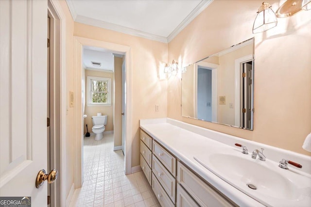 bathroom with vanity, crown molding, tile patterned floors, and toilet