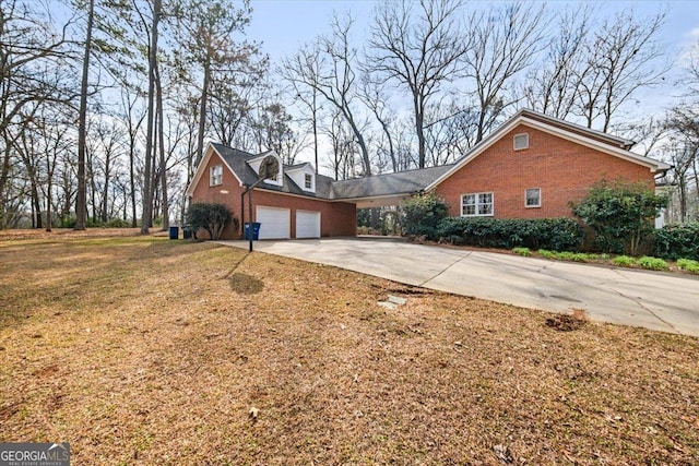 view of front of property with a garage and a front yard