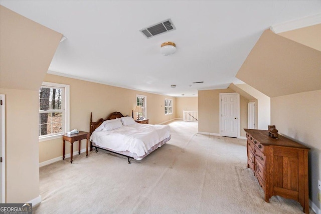 bedroom featuring light colored carpet