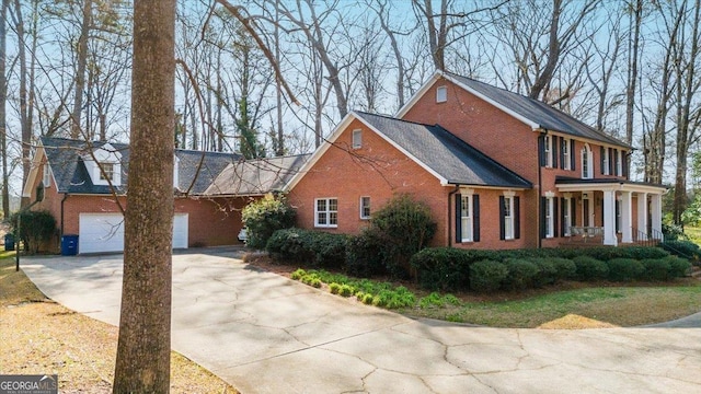 view of front facade featuring a garage and covered porch