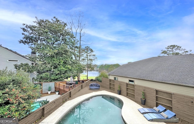 view of swimming pool featuring a deck with water view