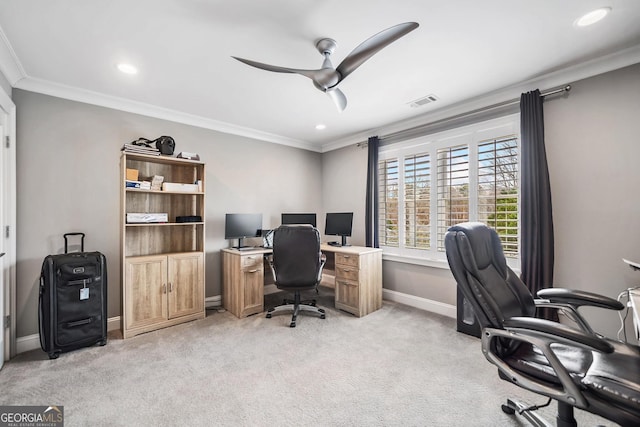 carpeted office featuring crown molding and ceiling fan