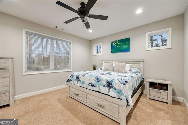 bedroom with recessed lighting, visible vents, baseboards, and light colored carpet