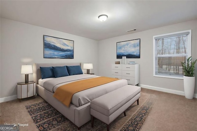 bedroom featuring carpet, visible vents, and baseboards