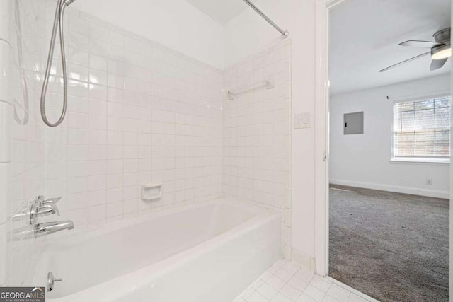 bathroom with tile patterned flooring, tiled shower / bath combo, and ceiling fan