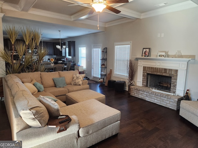 128 Lavender Way Lot 75, Mcdonough, GA 30252 - living area with ceiling fan, dark wood-type flooring, ornamental molding, a brick fireplace, and beamed ceiling