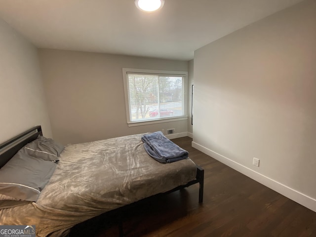 bedroom featuring dark hardwood / wood-style floors