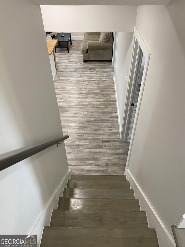 stairs with wood-type flooring