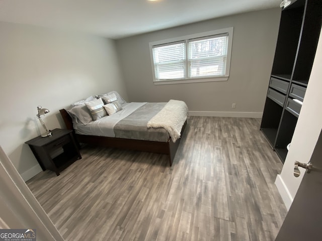 bedroom featuring dark wood-type flooring