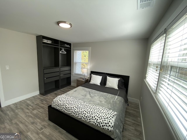 bedroom with hardwood / wood-style floors