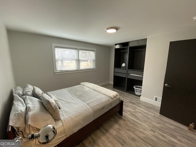 bedroom featuring hardwood / wood-style flooring