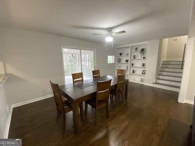 dining space featuring dark wood-type flooring and ceiling fan