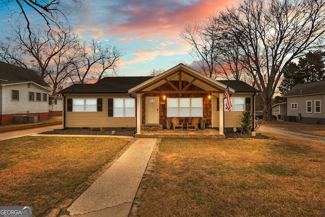 ranch-style house featuring a yard