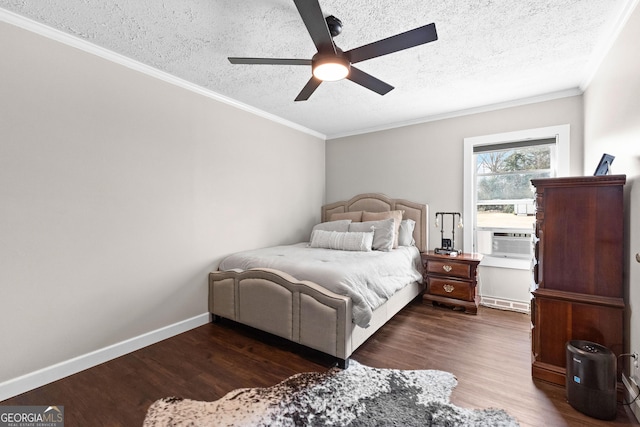 bedroom with ceiling fan, ornamental molding, dark hardwood / wood-style floors, and a textured ceiling