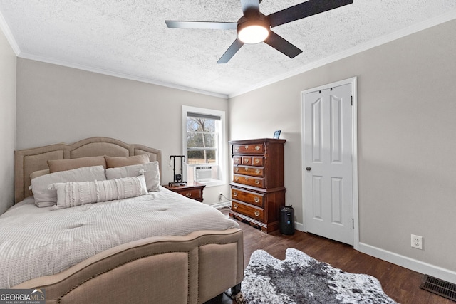 bedroom with ornamental molding, dark hardwood / wood-style floors, cooling unit, and a textured ceiling