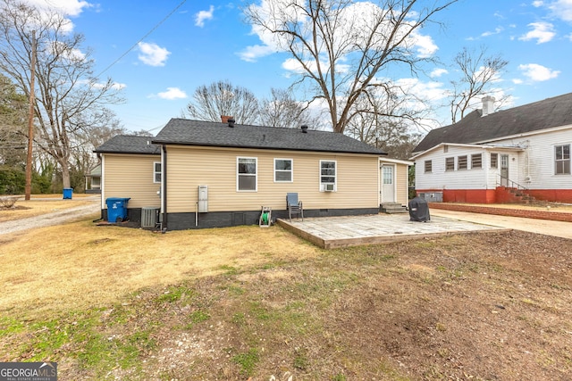 back of property featuring a patio, a yard, and central AC