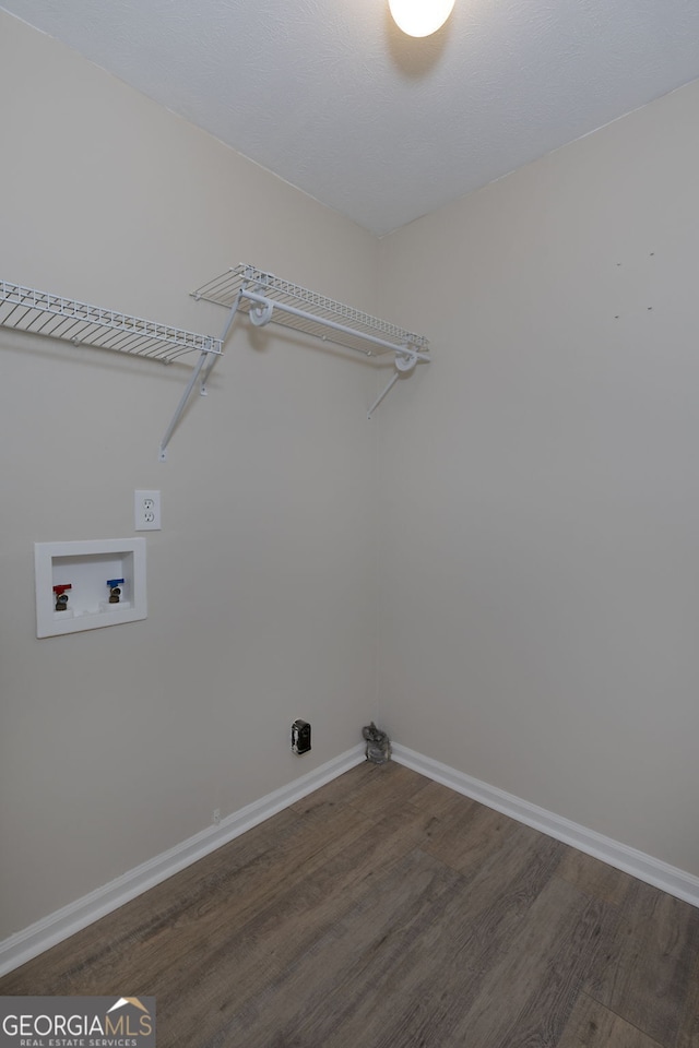 laundry room with hookup for a washing machine and dark hardwood / wood-style flooring