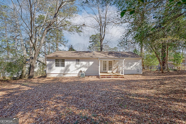 rear view of house featuring french doors