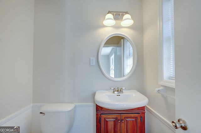 bathroom with vanity and toilet