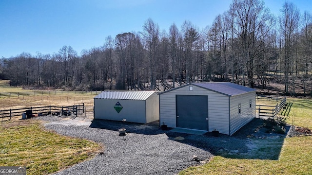 view of outbuilding featuring a lawn and a rural view