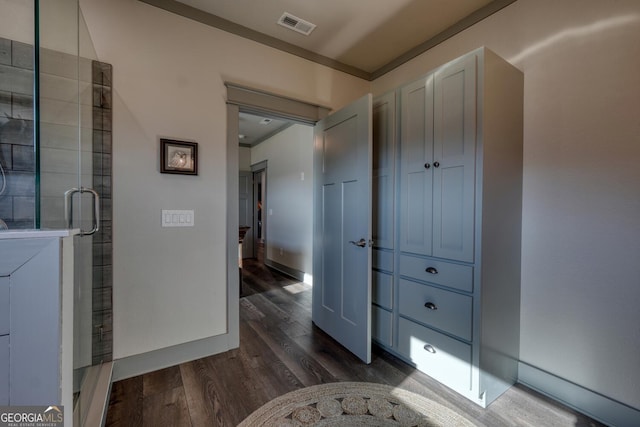 hall with dark hardwood / wood-style floors