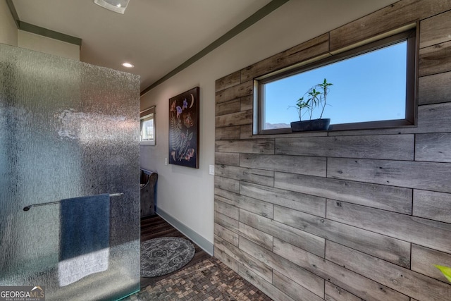 bathroom with wood walls