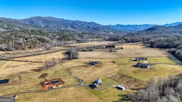 drone / aerial view featuring a mountain view and a rural view