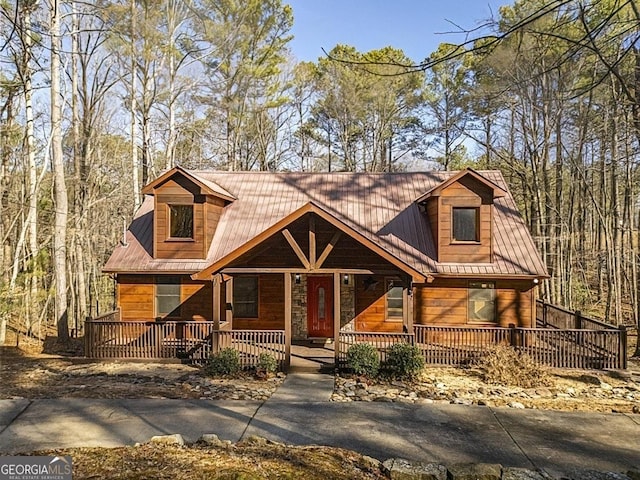 log cabin with covered porch