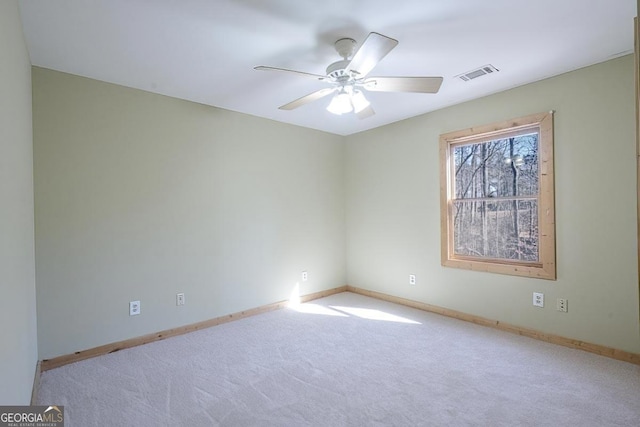 carpeted empty room with ceiling fan