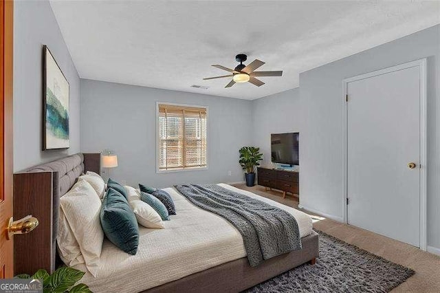 carpeted bedroom with ceiling fan