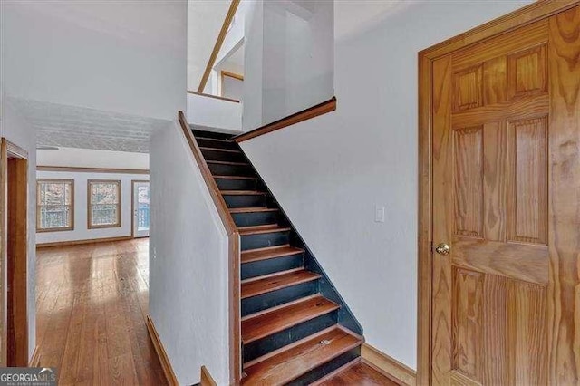 stairway featuring hardwood / wood-style flooring