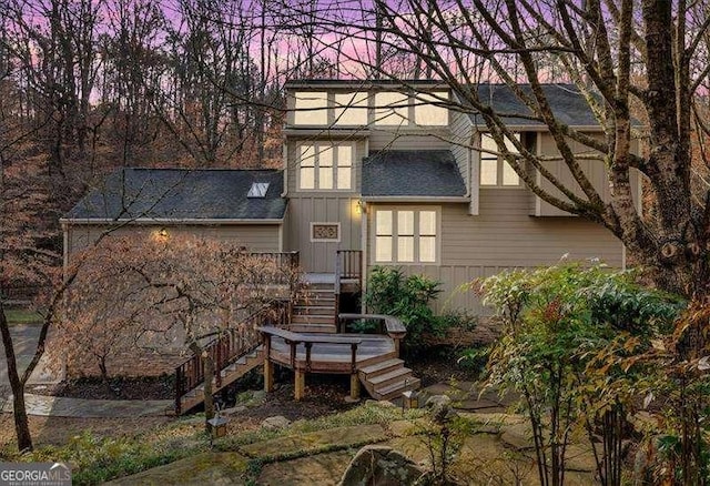 view of back house at dusk