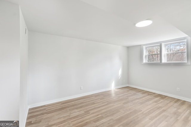 unfurnished room with light hardwood / wood-style floors