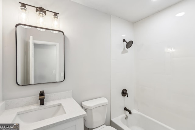 full bathroom with vanity, toilet, and tiled shower / bath