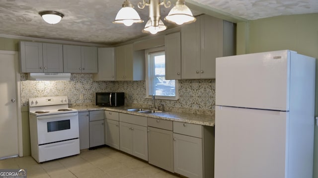 kitchen with sink, extractor fan, pendant lighting, white appliances, and backsplash