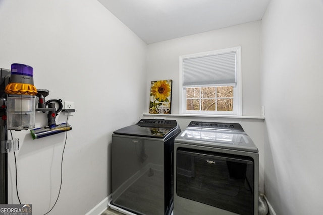 laundry area with washing machine and clothes dryer