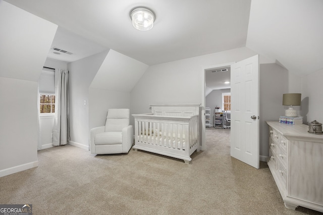 carpeted bedroom with vaulted ceiling